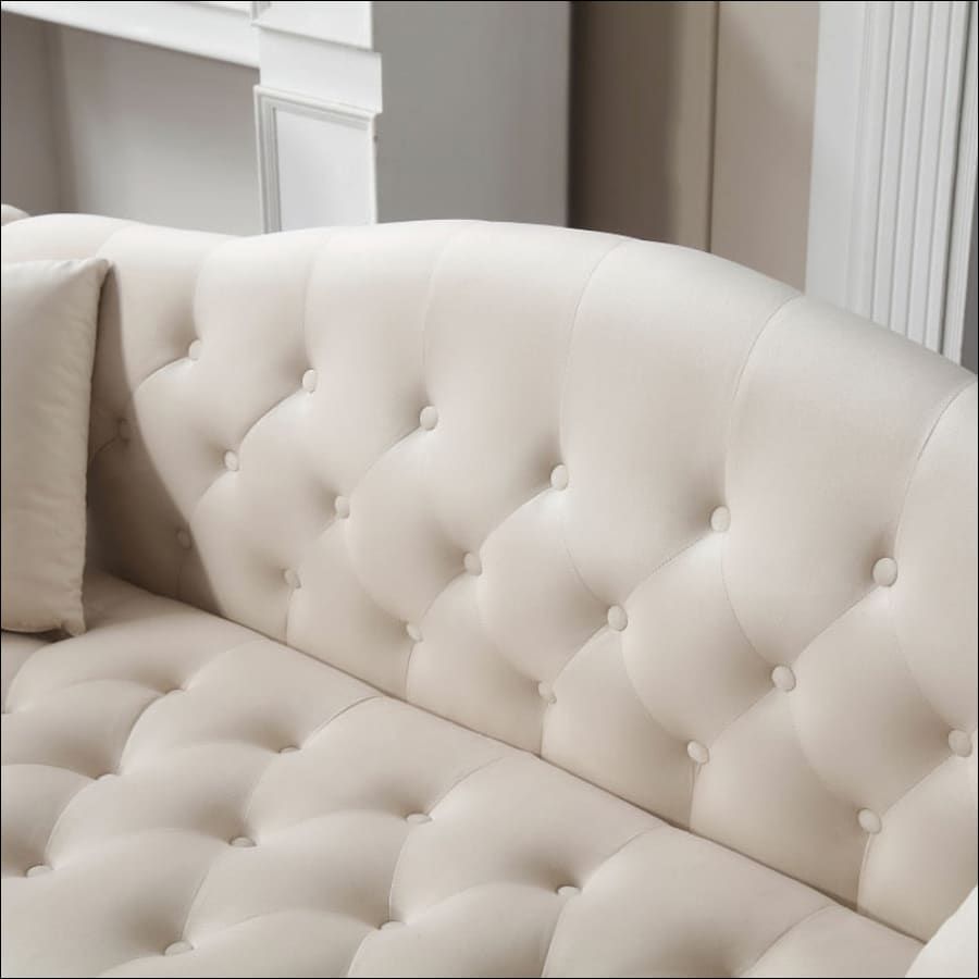 Cream Chesterfield Couch Loveseat with Trimmed Curved - scrolled arms - tufted couch with silver hardware - hausgem - united states - close up view of cushion